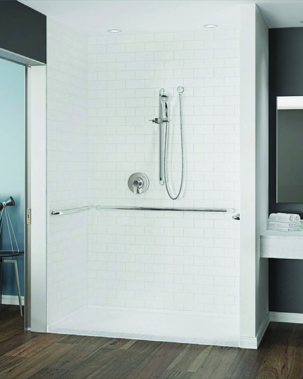 Barrier-free shower with white classic subway walls, grab bars and a hand shower