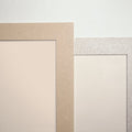 Corner detail of solid-surface wall trim in sand and gray