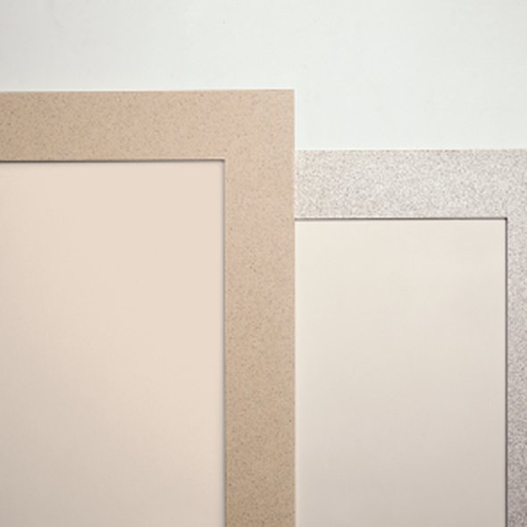 Corner detail of solid-surface wall trim in sand and gray