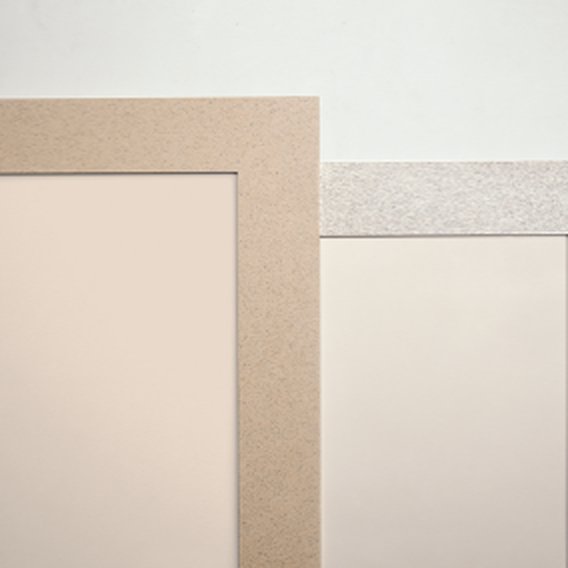 Corner detail of solid-surface wall trim in sand and gray